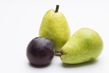 Pears and plum isolated on white