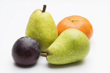 Pears, plum and clementine isolated on white