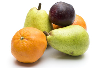 Pears, plum and clementines isolated on white