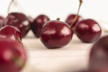 Toned shot of fresh ripe cherries on white background