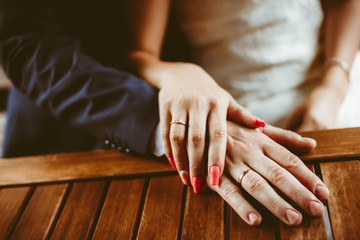 hands of newlyweds with rings