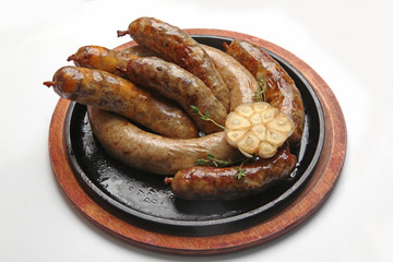 frying pan with homemade sausages