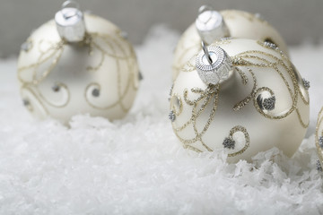 Silver Christmas decorations on snow