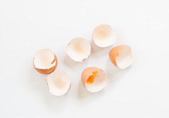 Group of broken chicken eggshells on white background.
