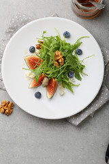 Fresh salad with blue cheese and fruits
