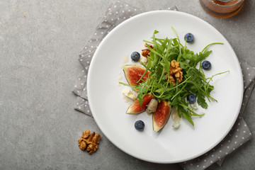 Fresh salad with cheese and figs