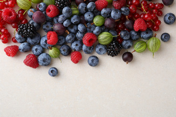 Fresh berries mix on concrete background