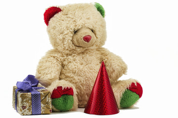 Teddy with a packet with a gift and a red cap