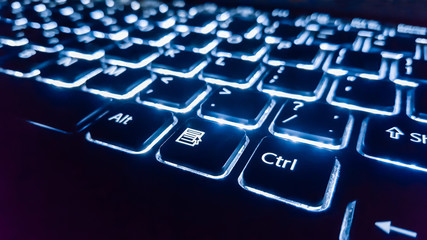 Neon keyboard with enter button. Focus on the  . - obrazy, fototapety, plakaty