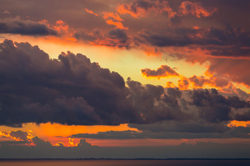 Abstract background of beautiful sunrise and dramatic clouds on the sky.