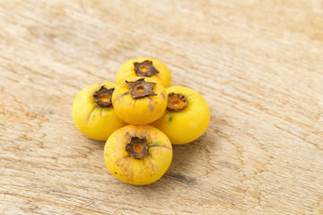 Naklejka na ściany i meble Gold Apple, Diospyros decandra Lour. Thai fruit and Thai herb.on