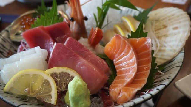 Japanese cuisine premium sashimi platter. salmon, tuna, scallop, shrimp, salmon roe, sea urchin and surf clam