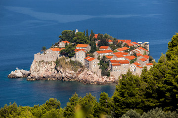 Fototapeta na wymiar Sveti Stefan or Saint Stefan is a small islet and 5-star hotel resort on the Adriatic coast of Montenegro