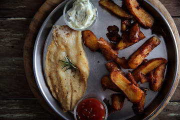 fish and chips on wooden background