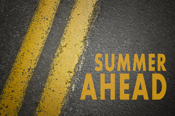 Fototapeta premium Summer concept. Summer ahead written on road.