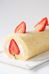 roll cake topping with strawberry