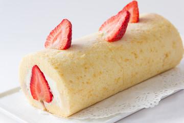 roll cake topping with strawberry