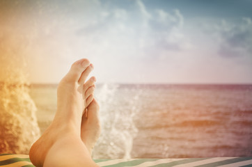 Legs on the background of the sea