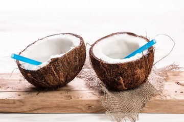 Coconut on wooden table.