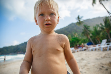 Portrait of little toddler on a beach