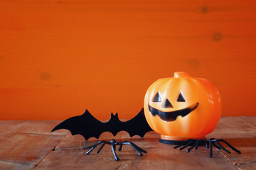 Halloween holiday concept. Cute pumpkin and bat