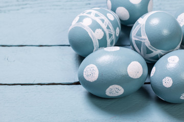 Easter concept with colored eggs on wooden background
