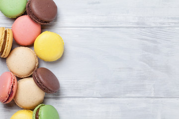 Colorful macaroons on wooden table