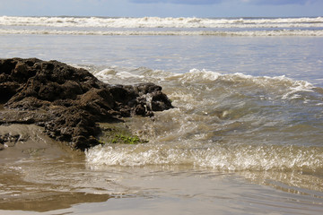 Waves of the sea between rocks