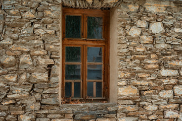 Fototapeta na wymiar Window at one old Bulgarian house in Kovachevitsa village, Bulgaria