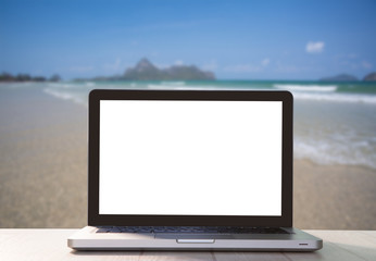 Fototapeta premium laptop on table at sea