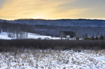 Farm in Winter with View of Mountains