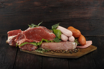 meat with spices on wooden background