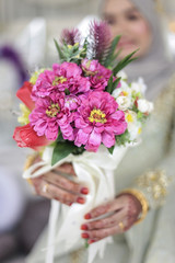 Wedding flowers ,Woman holding colorful bouquet with her hands