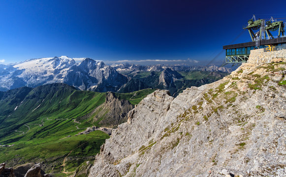 Dolomiti - aerial view of Pordoi pass from Sass pordoi mount. On background Mount Marmolada