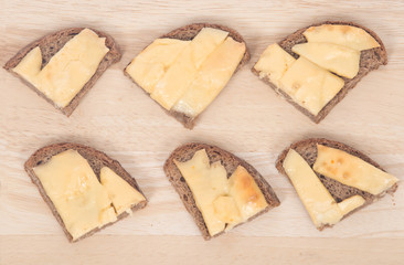 Hot sandwiches on cutting board with home made rye bread and melting cheese