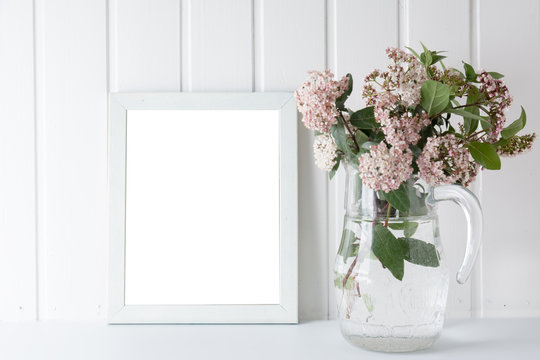 empty picture frame, decorated with small pink flowers