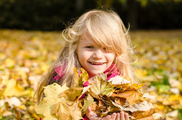 happy smiling child in autumn time