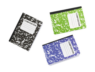 Composition notebooks on a white background.