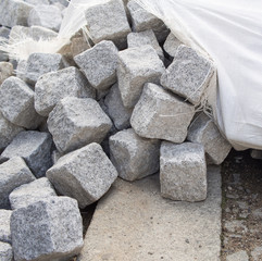 Pile Of Cobblestones With A Cracked Cotton Sack