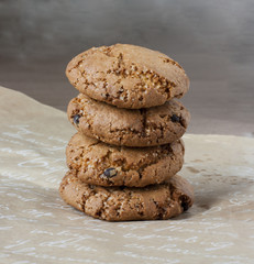 Fototapeta na wymiar Chocolate chip cookies on grey background. Cookies on paper.