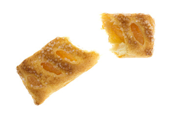 Broken apple fruit tart on a white background