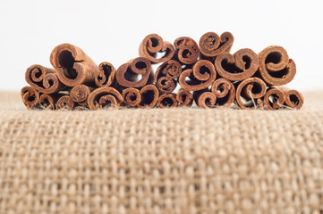 Cinnamon sticks on burlap fabric with faded effect