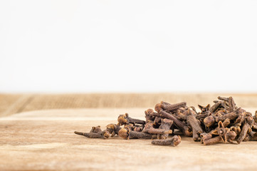 Cloves on wood background with faded effect