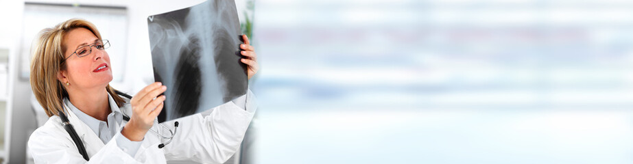 Mature doctor woman with radiograph.