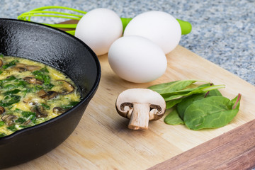 Uncooked spinach mushroom frittata.