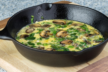 Uncooked spinach mushroom frittata.