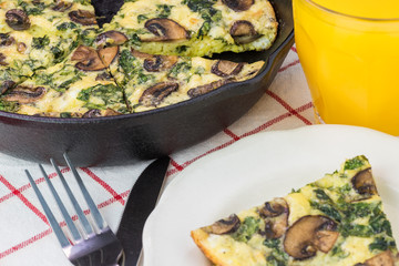 Fresh cooked spinach mushroom frittata.