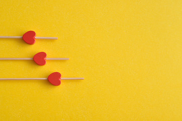 Valentine's Day. Three red hearts on sticks 