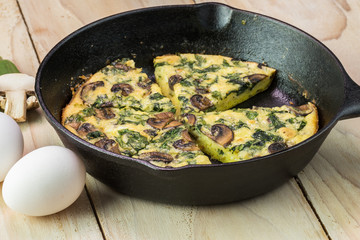 Fresh cooked spinach mushroom frittata.