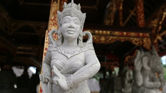 Ancient Stone Sculpture - Statue in Traditional Balinese Temple near Ubud, Bali, Indonesia